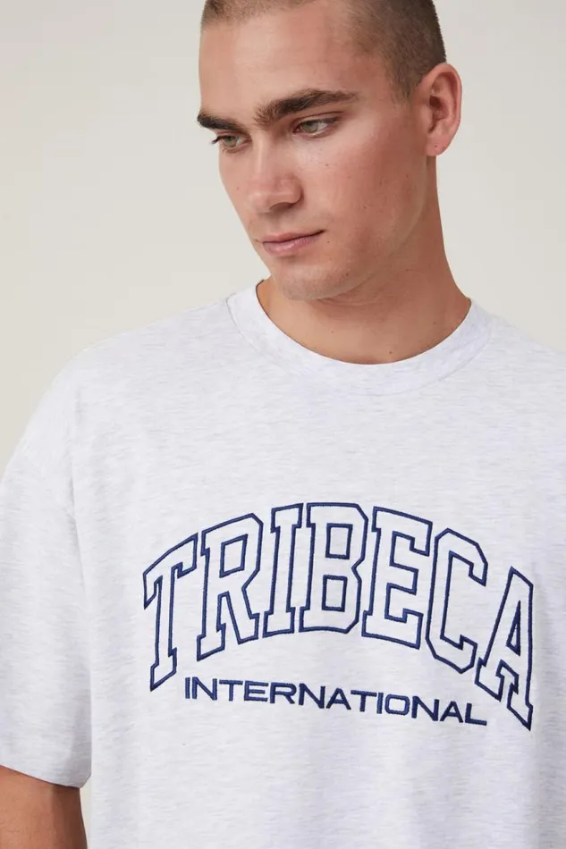 Cotton On Tees and Tanks Box Fit College TShirt White Marle Tribeca International 8211 Men Cotton On Tees and Tanks Box Fit College TShirt White Marle Tribeca International 8211 Men
