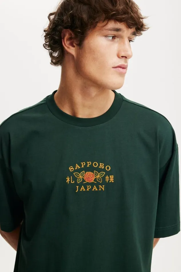 Cotton On Tees and Tanks Box Fit Graphic TShirt Pineneedle Greensapporo 8211 Men Cotton On Tees and Tanks Box Fit Graphic TShirt Pineneedle Greensapporo 8211 Men